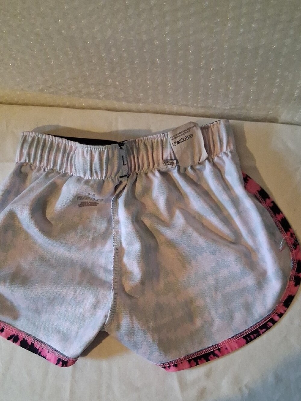 Under Armour Pink and Black Printed Women’s Athletic Shorts - Picture 5 of 8